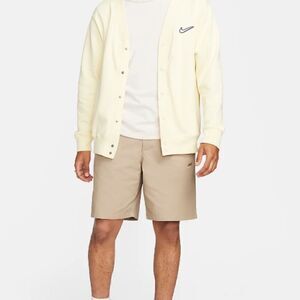 - Nike pleated front 9 in  khaki shorts with button closure back pockets